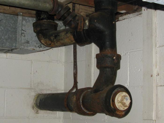 iron cast pipe drain sewer line repair pipes toilet tap nj plumbing fitting cut wye between foundation diy