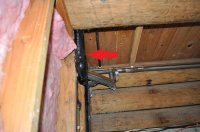 Pipe sticking out past joist.JPG