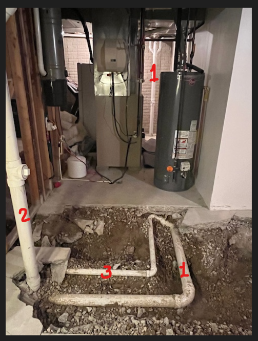Basement bathroom picture drain and vent pipes.png
