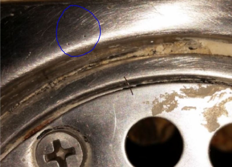 circled rust holes.JPG