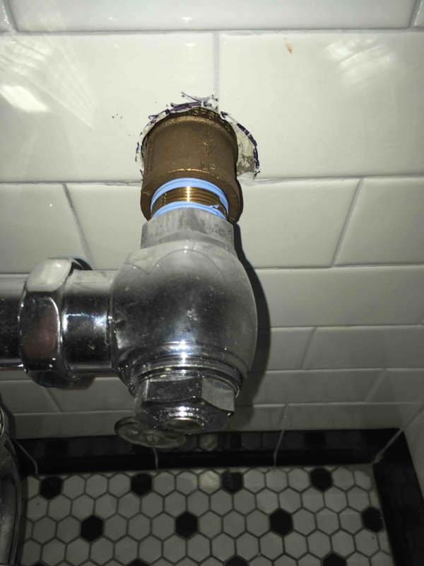 exposed flushometer pipe.jpg