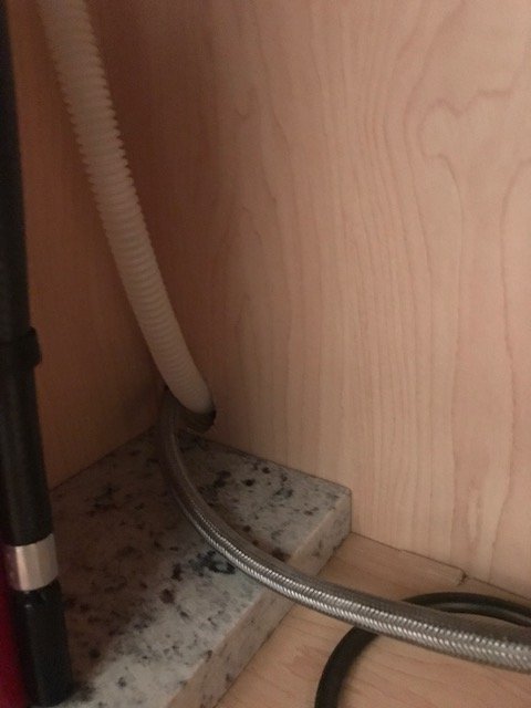 What Could Be Causing A Smell Coming From Under The Kitchen Sink
