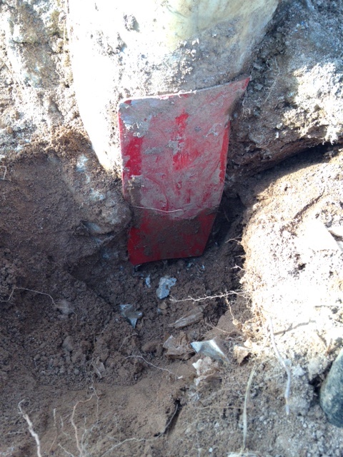 Red plastic over hole.jpg