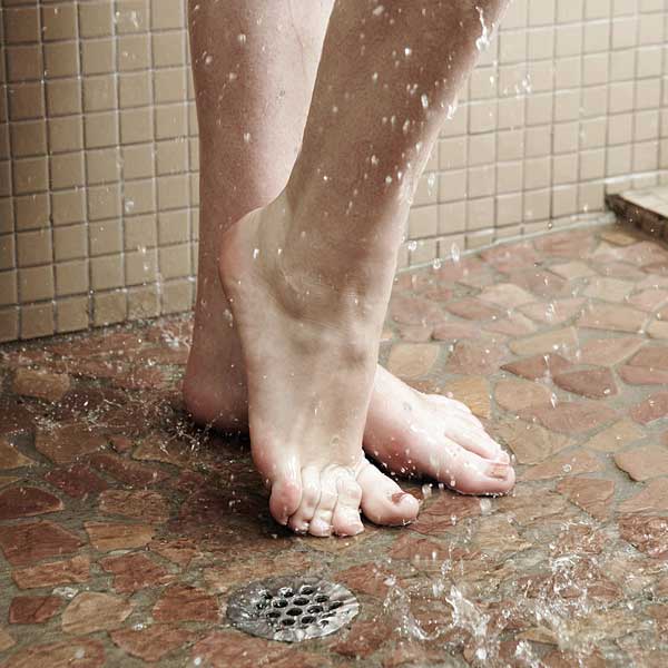 woman-feet-shower-drain.jpg